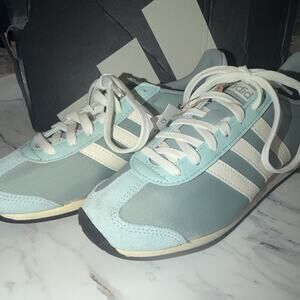 adidas Runvista women’s 
Low Top Lace-Up Athletic Sneakers Light Blue/White